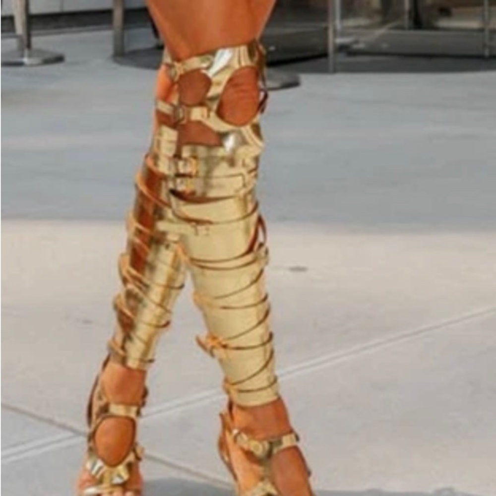 Gold thigh, high heel boots..